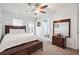 Light bedroom with ample space and a view, featuring a dresser with a large mirror at , Atlanta, GA 30318