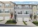 Attractive townhome exteriors showcasing varied color schemes, inviting entryways, and convenient attached garages at , Atlanta, GA 30318