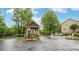 Community entry gatehouse with colorful landscaping and secure entry access at , Atlanta, GA 30318