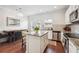 Bright kitchen featuring stainless steel appliances, granite countertops, and island with seating at , Atlanta, GA 30318