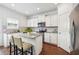 Bright kitchen featuring granite countertops, stainless steel appliances, a convenient island, and white cabinetry at , Atlanta, GA 30318