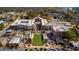An aerial view of an upscale neighborhood with a mix of residential and commercial buildings and a green central park at 2300 Newport Lndg, Atlanta, GA 30009
