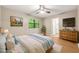 Inviting bedroom features a serene color palette, with ample natural light and a large dresser at 2300 Newport Lndg, Atlanta, GA 30009