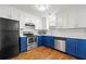 Modern kitchen featuring stainless steel appliances, and white and blue cabinets at 2300 Newport Lndg, Atlanta, GA 30009