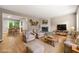 Spacious living room featuring a fireplace, neutral decor, and hardwood flooring at 2300 Newport Lndg, Atlanta, GA 30009