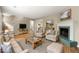 Bright living room featuring a fireplace, comfortable seating, and hardwood flooring at 2300 Newport Lndg, Atlanta, GA 30009
