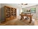 This office features a ceiling fan, and a large desk, with great natural light from the windows at 2300 Newport Lndg, Atlanta, GA 30009