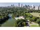 Scenic aerial shot of Piedmont Park with lake and city skyline in the background at 272 14Th St # 23, Atlanta, GA 30309