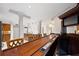 Spacious bar area with a long wooden counter, seating, and a convenient mini-fridge; perfect for entertaining at 272 14Th St # 23, Atlanta, GA 30309
