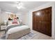 Cozy bedroom featuring a double bed, neutral decor, and a closet for ample storage at 272 14Th St # 23, Atlanta, GA 30309