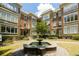 Classic brick apartment building with a central water fountain and manicured landscaping at 272 14Th St # 23, Atlanta, GA 30309