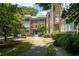 Beautiful brick apartment building featuring manicured landscaping and a charming walkway at 272 14Th St # 23, Atlanta, GA 30309