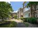 Elegant brick apartment building with lush landscaping and inviting entrance at 272 14Th St # 23, Atlanta, GA 30309