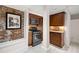 Charming kitchen featuring granite counters, stainless appliances and exposed brick accent wall at 272 14Th St # 23, Atlanta, GA 30309