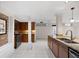 Bright kitchen with stainless steel appliances, granite counters, wood cabinets and tile flooring throughout at 272 14Th St # 23, Atlanta, GA 30309
