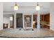 Well-lit kitchen with stainless steel appliances, stylish pendant lighting, and a large granite island at 272 14Th St # 23, Atlanta, GA 30309