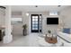 Bright living area with tiled floors, modern decor, and TV at 272 14Th St # 23, Atlanta, GA 30309