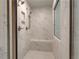 Shower room with white marble tiles, seating and multiple shower heads at 2780 Dolce Rd, Dacula, GA 30019