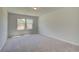 Bright, spacious bedroom with neutral carpet, two windows allowing natural light and outside views at 2780 Dolce Rd, Dacula, GA 30019