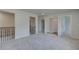 Spacious upstairs room with a walk-in closet and easy access to other rooms, carpet flooring at 2780 Dolce Rd, Dacula, GA 30019
