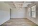 Bright dining room features a coffered ceiling, wainscoting, and wood-look floors at 2780 Dolce Rd, Dacula, GA 30019