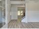 Elegant entryway with wood-look floors, decorative wainscoting and a staircase with iron balusters at 2780 Dolce Rd, Dacula, GA 30019