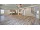 Open-concept living space with living room, kitchen and a staircase with iron balusters at 2780 Dolce Rd, Dacula, GA 30019