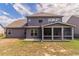 Backyard featuring screened in porch and well-maintained lawn at 2910 Hampton Grove Trce, Dacula, GA 30019
