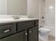 Bathroom vanity and shower combination with dark wood cabinets at 2910 Hampton Grove Trce, Dacula, GA 30019