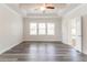 Spacious bedroom with tray ceiling, ceiling fan, and hardwood floors at 2910 Hampton Grove Trce, Dacula, GA 30019