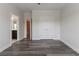 Bedroom showcasing hardwood floors and access to a bathroom at 2910 Hampton Grove Trce, Dacula, GA 30019