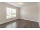 Bedroom with wood floors, white trim, and a large window at 2910 Hampton Grove Trce, Dacula, GA 30019