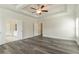 Bright bedroom with hardwood floors, ceiling fan and connecting doors at 2910 Hampton Grove Trce, Dacula, GA 30019