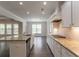 Well-lit kitchen with stainless steel appliances and granite counters at 2910 Hampton Grove Trce, Dacula, GA 30019