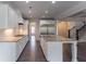 Spacious kitchen featuring white cabinets, granite countertops, and stainless steel appliances at 2910 Hampton Grove Trce, Dacula, GA 30019