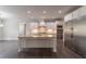 Modern kitchen with stainless steel appliances, granite counters, and a center island at 2910 Hampton Grove Trce, Dacula, GA 30019