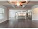 Open-concept living room showcasing kitchen with stainless steel appliances and island at 2910 Hampton Grove Trce, Dacula, GA 30019