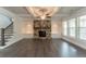 Inviting living room with stone fireplace, built-in shelves, and coffered ceiling at 2910 Hampton Grove Trce, Dacula, GA 30019