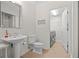 Bathroom with pedestal sink and walk-in laundry room featuring modern washer and dryer at 2950 Mount Wilkinson Se Pkwy # 505, Atlanta, GA 30339