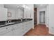 Well-appointed bathroom with double sinks, granite counters, and a glass-enclosed shower at 2950 Mount Wilkinson Se Pkwy # 505, Atlanta, GA 30339