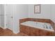 Bathroom with tiled in tub and decor at 2950 Mount Wilkinson Se Pkwy # 505, Atlanta, GA 30339