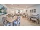 Bright community dining room offering residents decorative art and wooden tables and chairs at 2950 Mount Wilkinson Se Pkwy # 505, Atlanta, GA 30339
