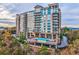 Upscale condo building featuring a rooftop pool and stunning city views at 2950 Mount Wilkinson Se Pkwy # 505, Atlanta, GA 30339