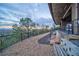 Scenic exterior view showcasing the property's landscaping, privacy fence, and distant city skyline at dusk at 2950 Mount Wilkinson Se Pkwy # 505, Atlanta, GA 30339