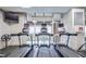 Well-equipped fitness center with treadmills overlooking the pool at 2950 Mount Wilkinson Se Pkwy # 505, Atlanta, GA 30339