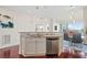 Modern kitchen features stainless steel appliances, granite counters and opens to dining area at 2950 Mount Wilkinson Se Pkwy # 505, Atlanta, GA 30339