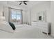 Bright main bedroom featuring a large window and tray ceilings at 2950 Mount Wilkinson Se Pkwy # 505, Atlanta, GA 30339