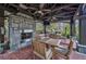 Outdoor kitchen with stone fireplace and dining area at 2950 Mount Wilkinson Se Pkwy # 505, Atlanta, GA 30339