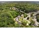 Aerial view of a neighborhood surrounded by lush greenery, showcasing the community's serene setting at 5404 Trumpet Vine Se Trl, Mableton, GA 30126