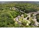 Aerial view shows the neighborhood featuring mature trees, well-maintained homes, and a sense of community and privacy at 5404 Trumpet Vine Se Trl, Mableton, GA 30126